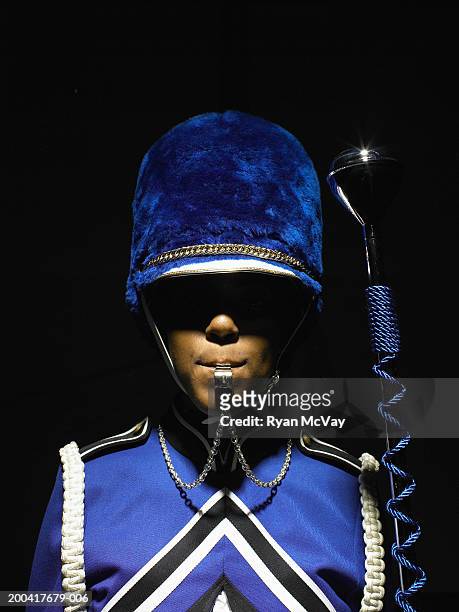 drum majorette blowing whistle, holding baton, portrait - drum majorette stock pictures, royalty-free photos & images