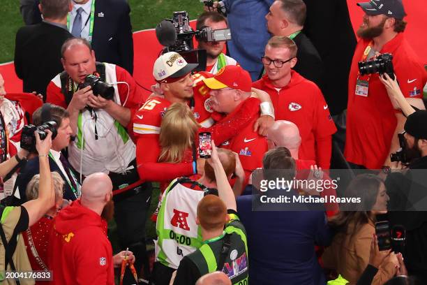 Patrick Mahomes of the Kansas City Chiefs hugs Head coach Andy Reid after defeating the San Francisco 49ers 25-22 in overtime during Super Bowl LVIII...
