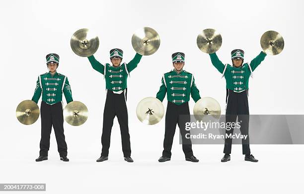 four teenagers (14-18) in band uniforms holding cymbals, portrait - cymbal bildbanksfoton och bilder