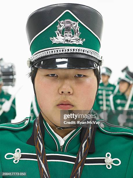 teenagers (15-17) in marching band (focus on boy in foreground) - fat asian boy stock pictures, royalty-free photos & images