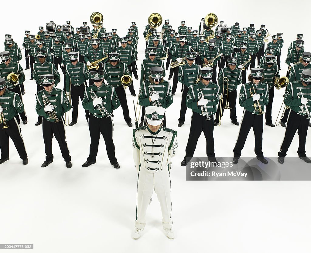 Teenage (14-18) marching band standing in rows, elevated view