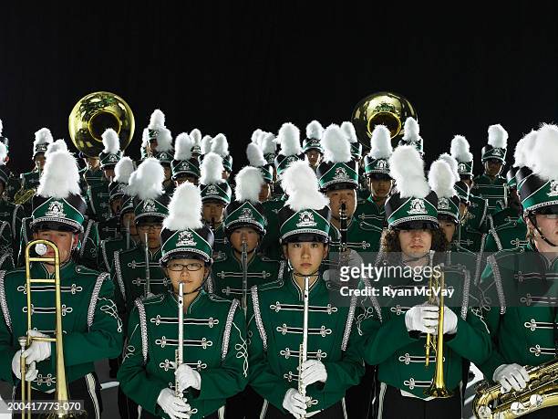 teenagers (14-18) in marching band uniforms holding wind instruments - organized group photo stock pictures, royalty-free photos & images