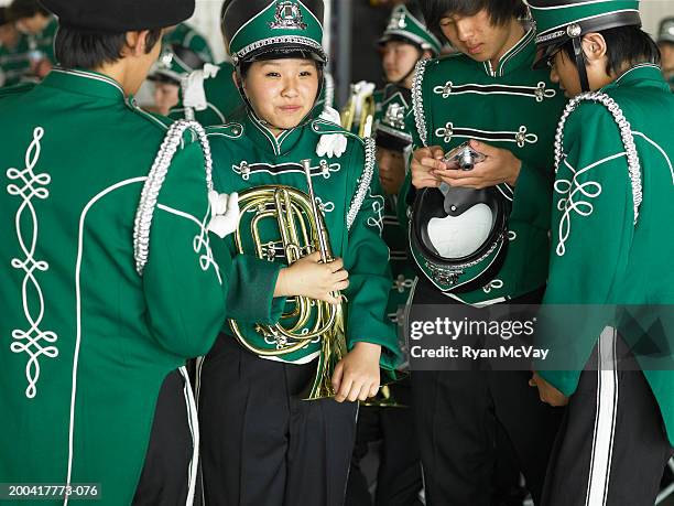 teenage (14-18) marching band (focus on girl holding wind instrument) - mellophone stock pictures, royalty-free photos & images