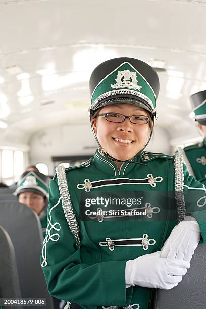 teenage (14-18) marching band on bus (focus on girl in foreground) - drum majorette stockfoto's en -beelden
