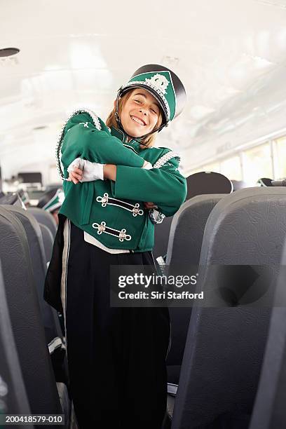 teenage (14-18) marching band on bus (focus on boy in foreground) - majorette stock pictures, royalty-free photos & images