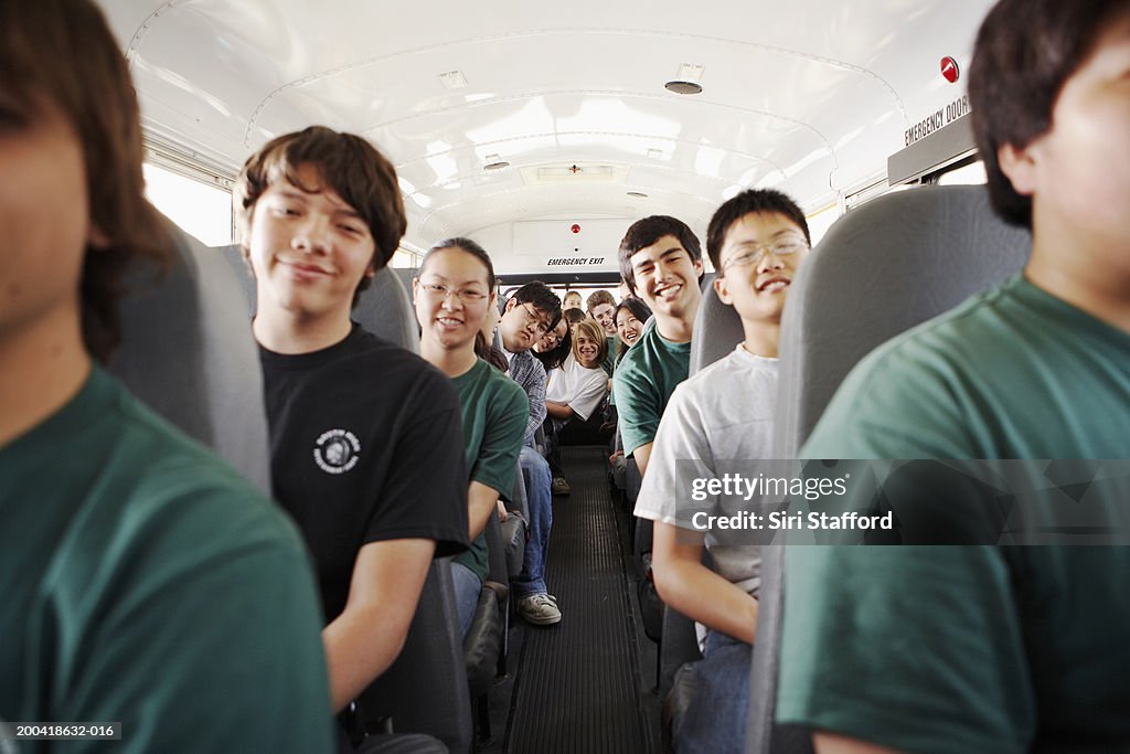 Teenagers (14-18) riding on school bus