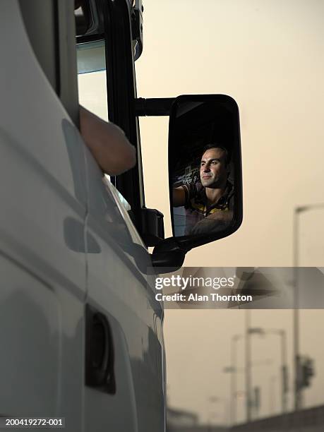 man reflected in side view mirror of truck - fahrzeugspiegel stock-fotos und bilder