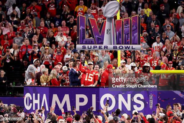 Patrick Mahomes of the Kansas City Chiefs holds the Lombardi Trophy after defeating the San Francisco 49ers 25-22 in overtime during Super Bowl LVIII...