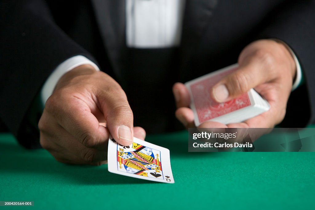 Man dealing deck of cards, close-up