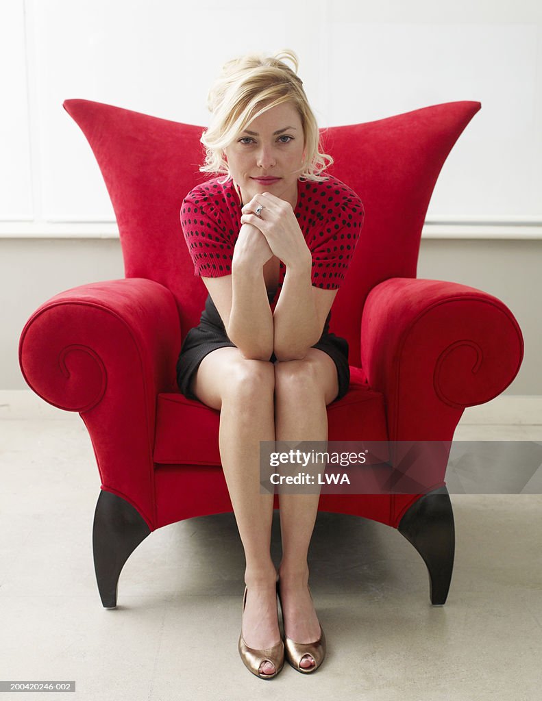 Young woman on chair, portrait