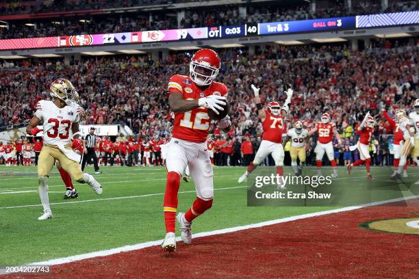 Mecole Hardman Jr. #12 of the Kansas City Chiefs celebrates after catching the game-winning touchdown in overtime to defeat the San Francisco 49ers...