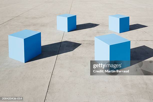 large blue blocks - vier gegenstände stock-fotos und bilder