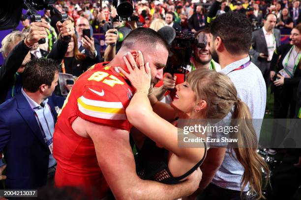 Travis Kelce of the Kansas City Chiefs celebrates with Taylor Swift after defeating the San Francisco 49ers 25-22 in overtime during Super Bowl LVIII...