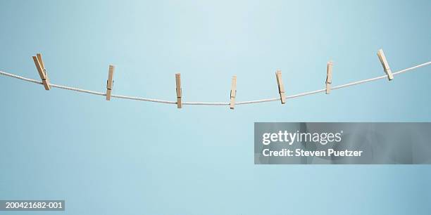 clothesline with clothespins - clothespin stock pictures, royalty-free photos & images