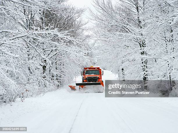usa, wisconsin, door county, snow plow driving down road - snowplough stock pictures, royalty-free photos & images