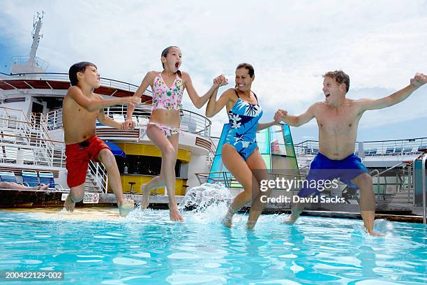parents with children (10-12) jumping into pool on cruise ship - kryssning bildbanksfoton och bilder