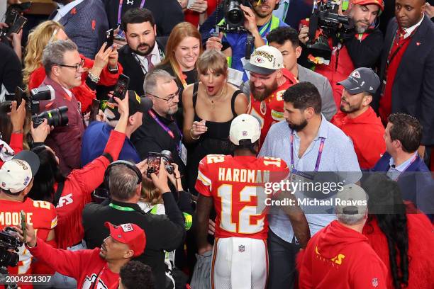 Mecole Hardman Jr. #12 of the Kansas City Chiefs celebrates with Travis Kelce and Taylor Swift after the Chiefs defeated the San Francisco 49ers...