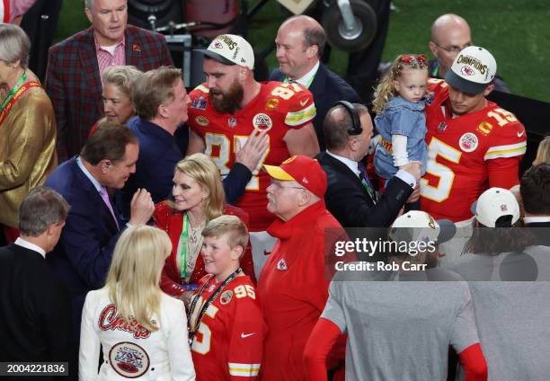 Travis Kelce of the Kansas City Chiefs interacts with Commissioner Roger Goodell after defeating the San Francisco 49ers 25-22 in overtime during...