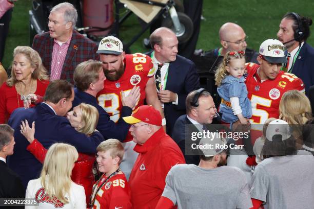 Travis Kelce of the Kansas City Chiefs interacts with Commissioner Roger Goodell after defeating the San Francisco 49ers 25-22 in overtime during...