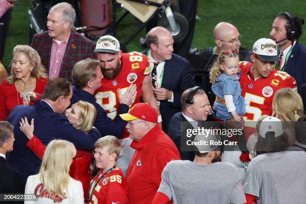 Travis Kelce of the Kansas City Chiefs interacts with Commissioner Roger Goodell after defeating the San Francisco 49ers 25-22 in overtime during...