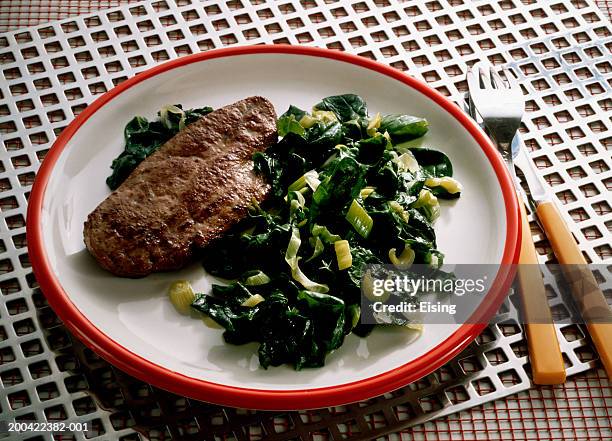 veal liver with spinach - beef liver stock pictures, royalty-free photos & images