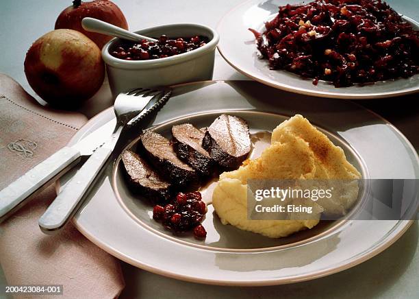 saddle of venison with cranberries - wildbret stock-fotos und bilder