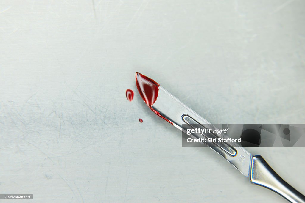 Scalpel with blood