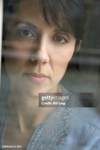 Window View Portrait Woman Portrait View Through Window Closeup High-Res Stock Photo - Getty ...