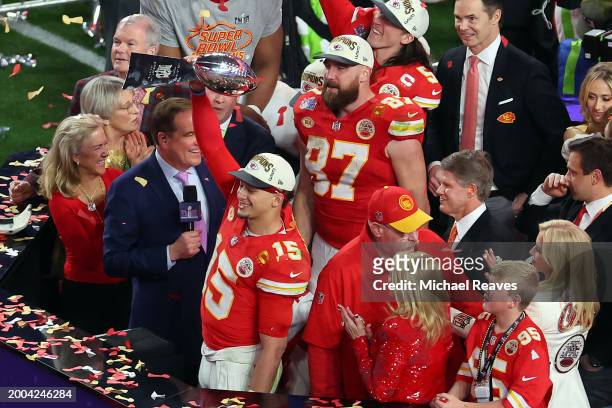 Patrick Mahomes of the Kansas City Chiefs raises the Lombardi Trophy after defeating the San Francisco 49ers 25-22 during Super Bowl LVIII at...