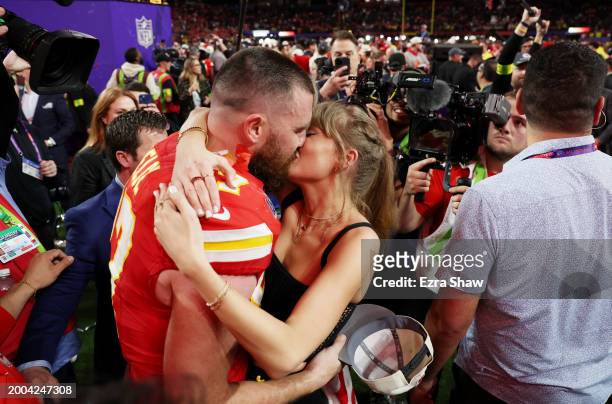 Travis Kelce of the Kansas City Chiefs and Taylor Swift embrace after defeating the San Francisco 49ers 25-22 in overtime during Super Bowl LVIII at...