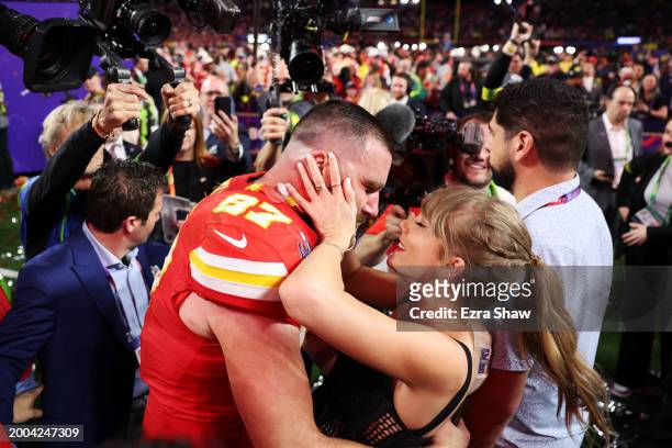 Travis Kelce of the Kansas City Chiefs and Taylor Swift embrace after defeating the San Francisco 49ers in overtime during Super Bowl LVIII at...