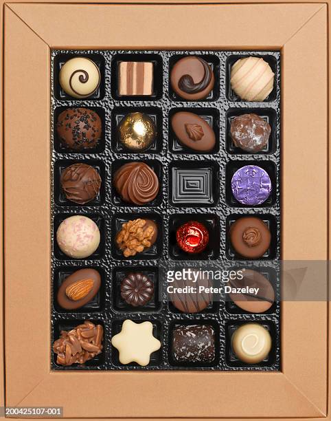 box of chocolates, one missing, overhead view - chocolates stock pictures, royalty-free photos & images