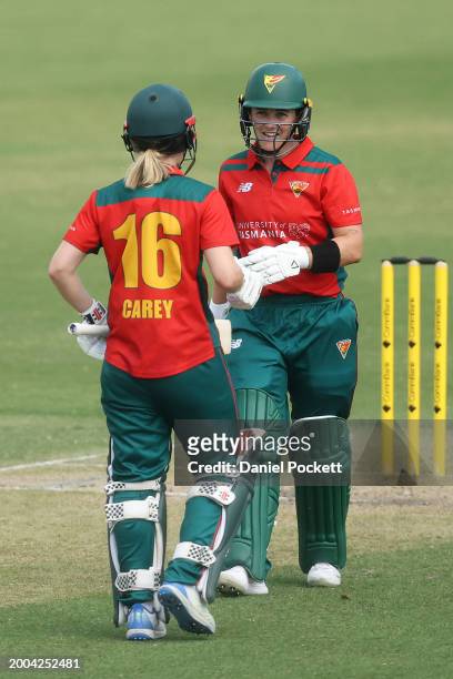 Heather Graham of Tasmania chats with Nicola Carey of Tasmania after hitting a six during the WNCL match between Victoria and Tasmania at CitiPower...