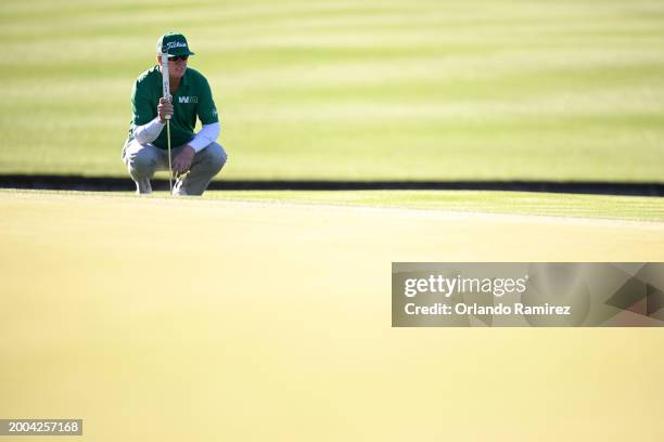 Charley Hoffman of the United States lines up his putt on the 15th green during the final round of the WM Phoenix Open at TPC Scottsdale on February...