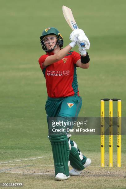 Heather Graham of Tasmania hits a six during the WNCL match between Victoria and Tasmania at CitiPower Centre, on February 12 in Melbourne, Australia.