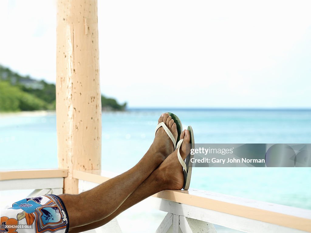 Resting On Railing Man Resting Feet On Railing Low Section Closeup High-Res Stock Photo ...