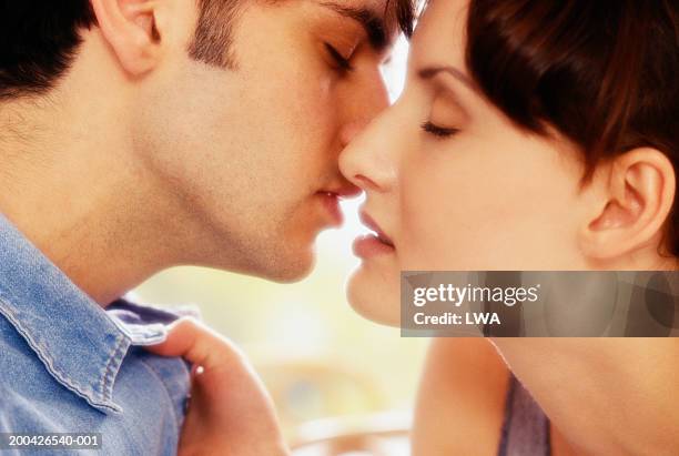 Couple About To Kiss Side View Closeup High-Res Stock Photo