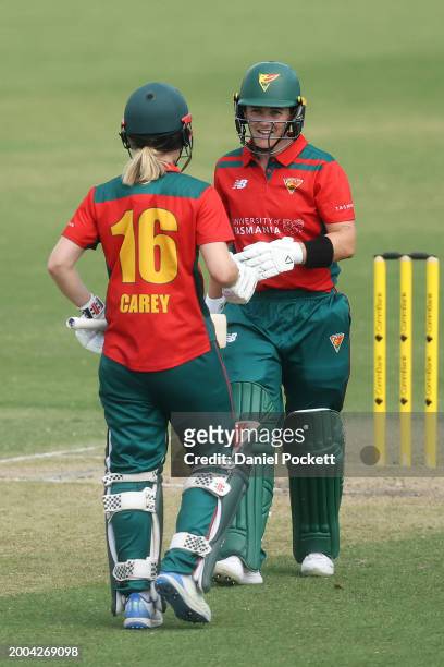 Heather Graham of Tasmania chats with Nicola Carey of Tasmania after hitting a six during the WNCL match between Victoria and Tasmania at CitiPower...