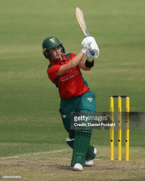 Heather Graham of Tasmania hits a six during the WNCL match between Victoria and Tasmania at CitiPower Centre, on February 12 in Melbourne, Australia.