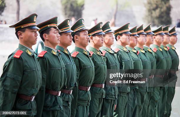 soldiers standing in line, side view - chinese army stock-fotos und bilder