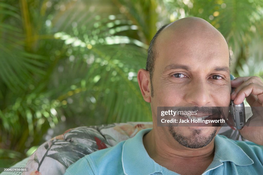 Portrait of a mature man talking on a mobile phone
