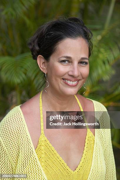 portrait of a mature woman smiling - halter top stock pictures, royalty-free photos & images