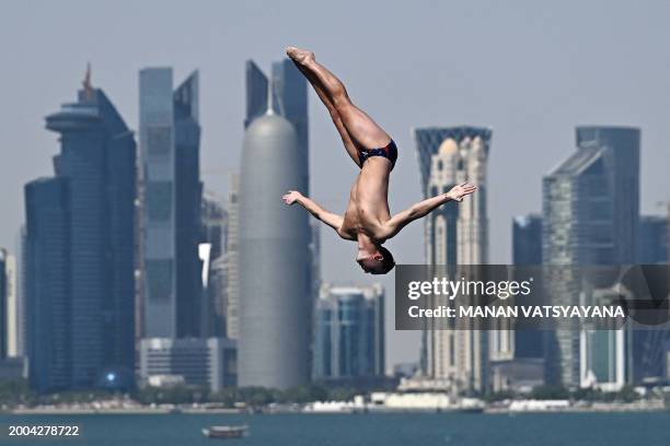 Great Britain's Aidan Heslop competes in the final of the men's high diving round 3 & 4 during the 2024 World Aquatics Championships at Doha Port in...