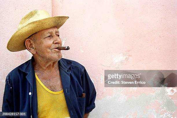 cuba, trinidad, senior man smoking cigar, looking away - cigar smokers stock pictures, royalty-free photos & images
