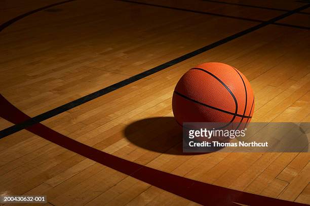 basketball on basketball court, elevated view - basketball stock-fotos und bilder