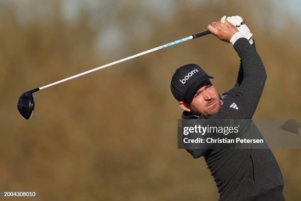 Nick Taylor of Canada plays a tee shot on the ninth hole during the continuation third round of the WM Phoenix Open at TPC Scottsdale on February 11,...