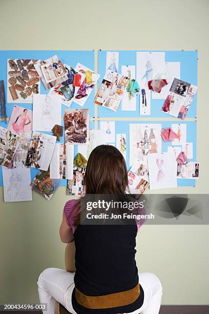 clothing designer looking at sketches, rear view - moodboard stock pictures, royalty-free photos & images