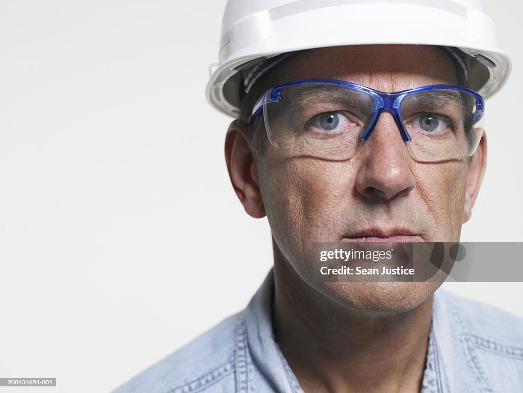 Mature workman wearing goggles, portrait, close-up