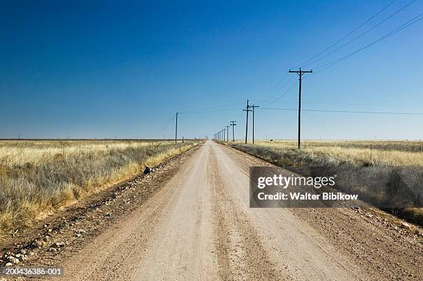 usa, texas, panhandle area, dirt road on ranch - texas road stock pictures, royalty-free photos & images