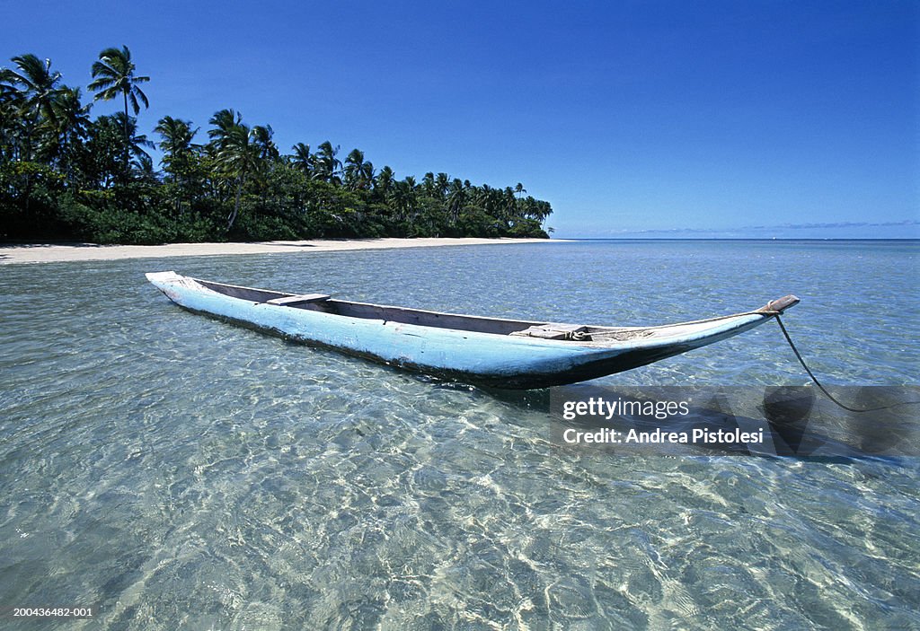Brazil, Bahia State, Morro de Sao Paulo, canoe by beach on island